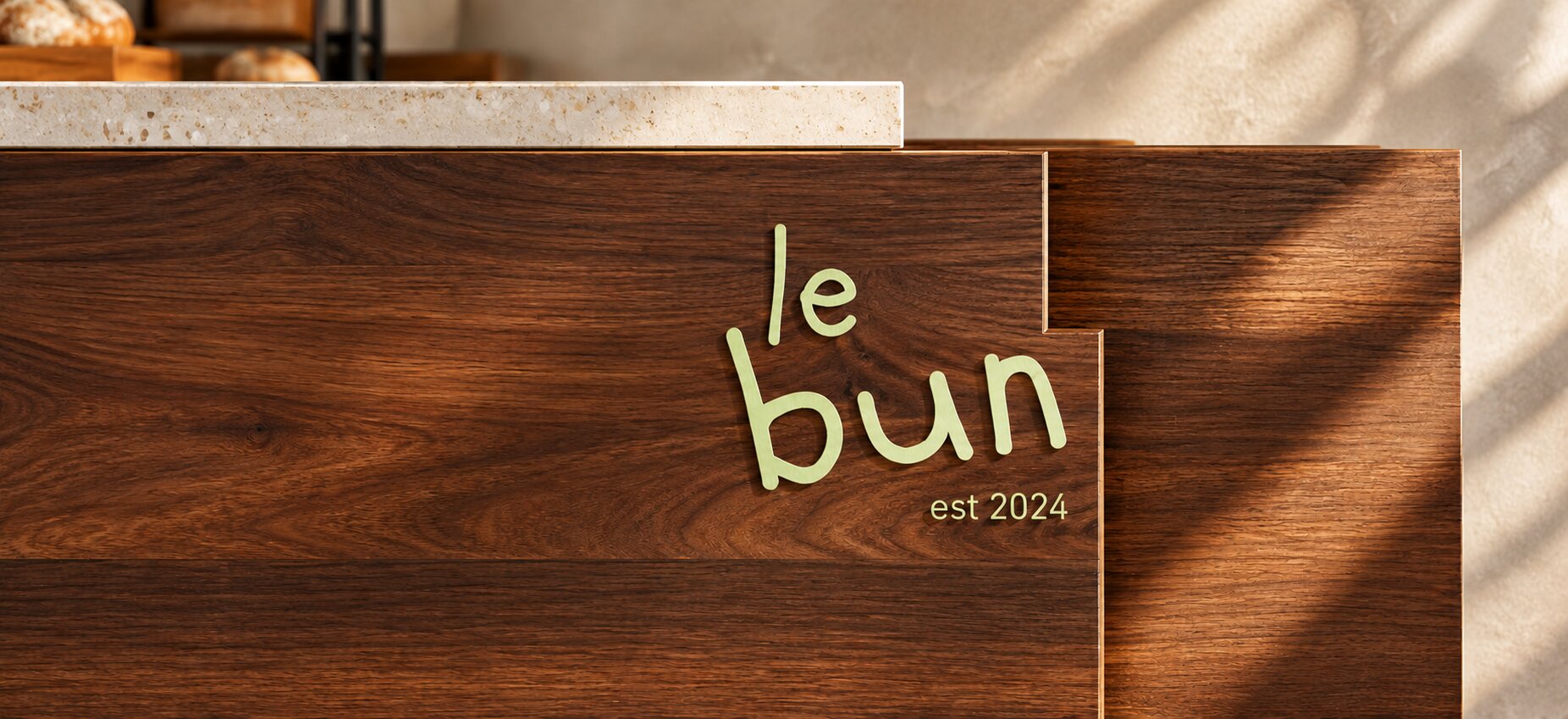Le Bun sign on walnut wood
